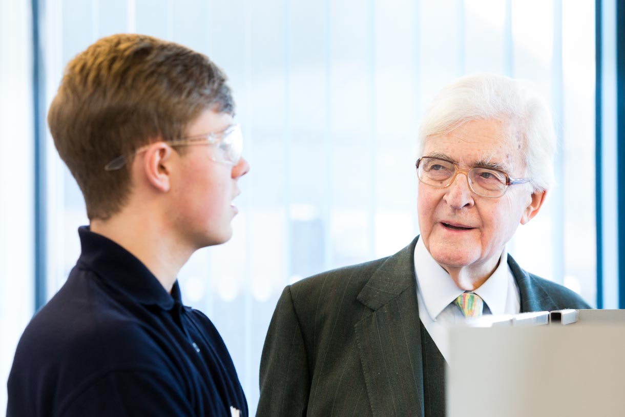 Lord Baker talking to a student