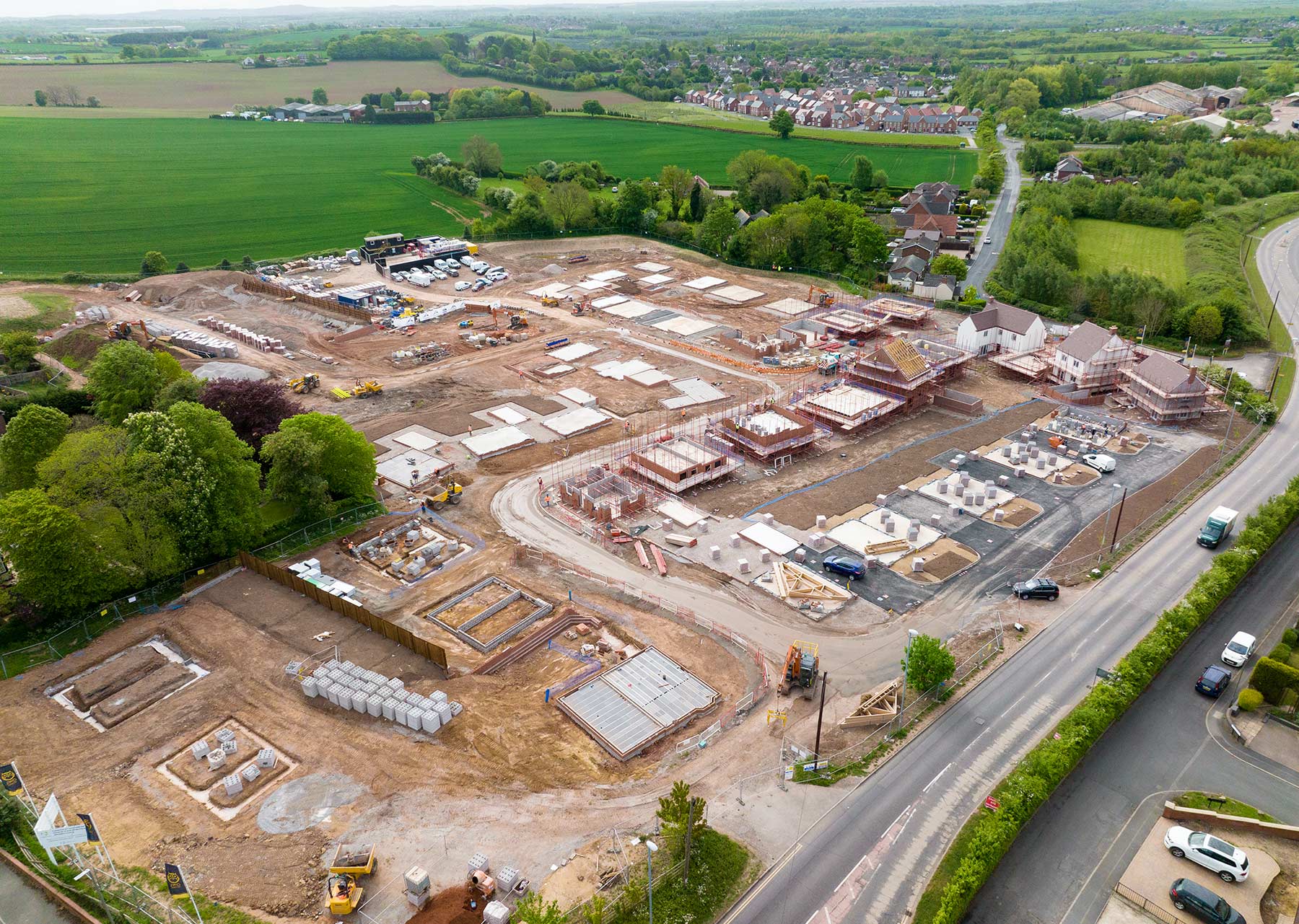 Aerailk view of a construction site  showing the round working of a housing development